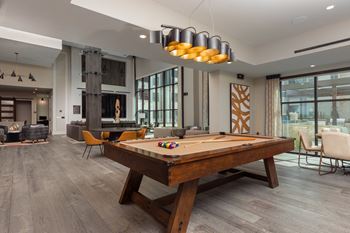 Game room with billiards and shuffleboard